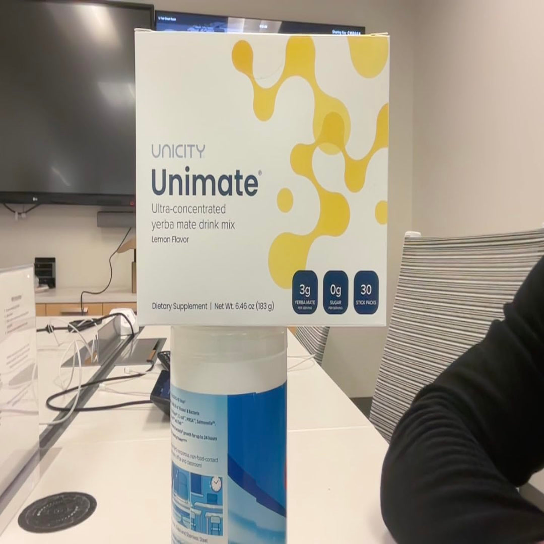 Box of Unicity Unimate supplement on a table in an indoor setting