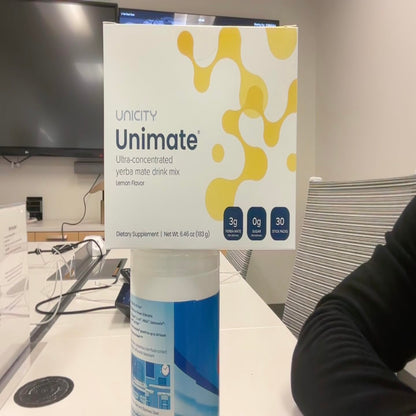 Box of Unicity Unimate supplement on a table in an indoor setting