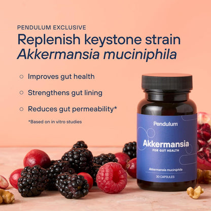 Bottle of Pendulum Akkermansia supplement with berries and nuts on a wooden surface