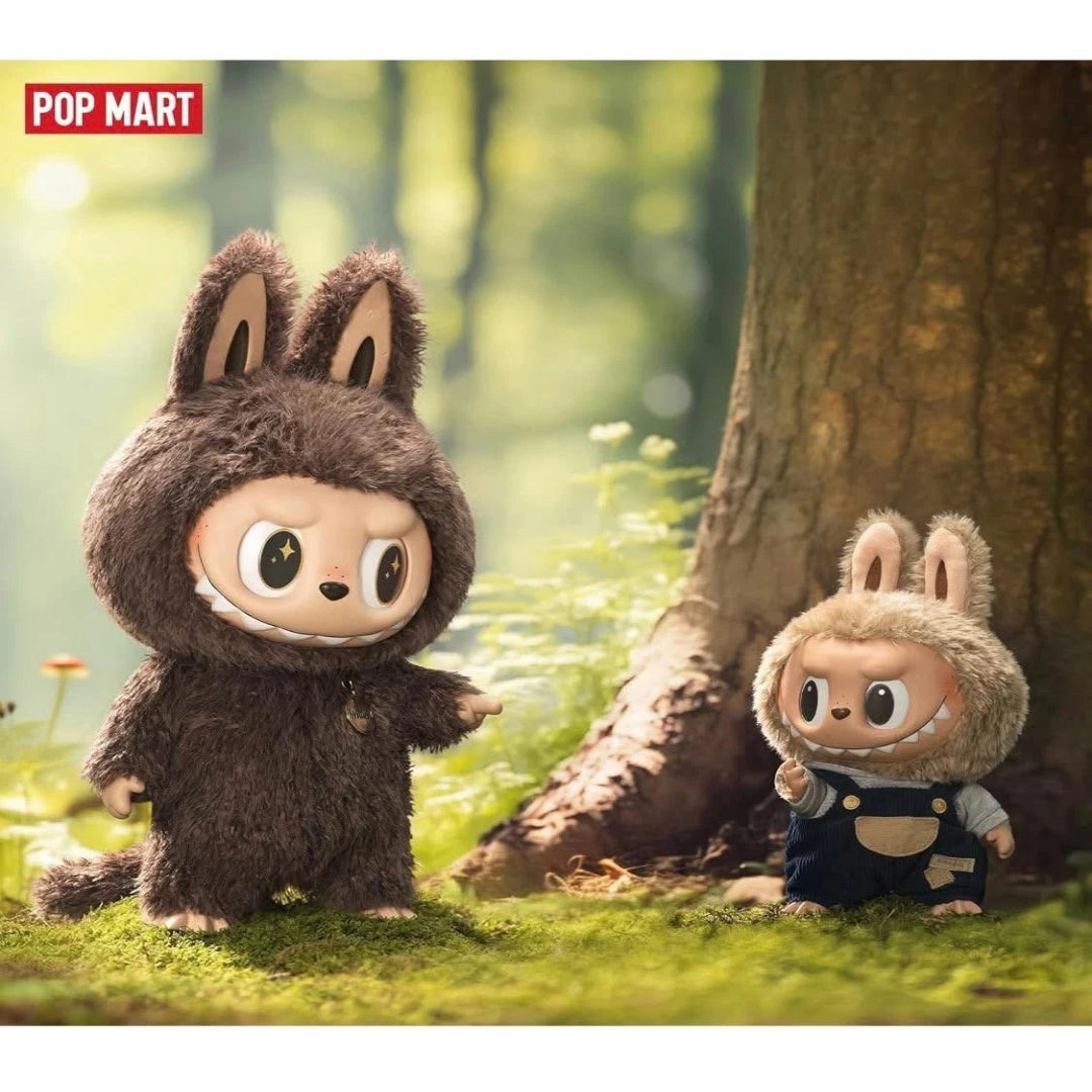 Two plush toys resembling animals in a forest setting with 'Pop Mart' branding.